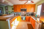 Cook`s kitchen with stainless steel appliances